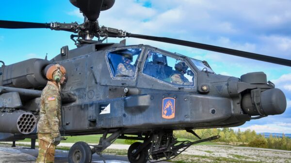 U.S. Soldiers assigned to 12th Combat Aviation Brigade conduct pre-flight checks on an AH-64D Apache longbow helicopter at the Grafenwoehr Training Area, Germany, Sept. 28, 2022. 12th CAB is among other units assigned to V Corps, America's Forward Deployed Corps in Europe. They work alongside NATO Allies and regional security partners to provide combat-ready forces, execute joint and multinational training exercises, and retain command and control for all rotational and assigned units in the European Theater. (U.S. Army photo by Sgt. Randis Monroe)