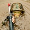 A candidates assigned to Delta Company, Officer Candidates Class-221, breaks the surface of the murky water of 'The Quigley' at Brown Field, Marine Corps Base Quantico, Va., on March 15, 2016. The mission of Officer Candidates School (OCS) is to "educate and train officer candidates in Marine Corps knowledge and skills within a controlled, challenging, and chaotic environment in order to evaluate and screen individuals for the leadership, moral, mental, and physical qualities required for commissioning as a Marine Corps officer." (U.S. Marine Corps Photo by Cpl. Patrick H. Owens/Released)