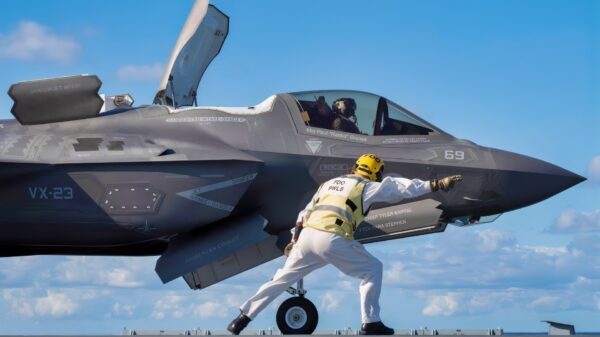 The HMS Prince of Wales (R09) aircraft carrier flight deck officer “shoots” an F-35B Lightning II short takeoff vertical landing (STOVL) variant fighter jet for a STO launch from a ski jump aboard the U.K.’s newest carrier Oct. 24, 2023. The 5th generation strike aircraft for Navy, Air Force, Marines, and allies is aboard to conduct developmental test phase 3 (DT-3) flight trials, which continue today. During the ship's deployment to the U.S. Eastern Seaboard for WESTLANT 2023, a Pax River F-35 Integrated Test Force (Pax ITF) team is working closely with the ship's company to conduct the sea trials that continue pushing the boundaries of carrier aviation. (Photo by Michael D. Jackson)