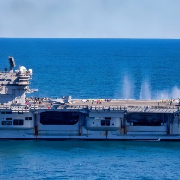 ATLANTIC OCEAN (Oct. 5, 2025) The Nimitz-class aircraft carrier USS George H.W. Bush (CVN 77) transits the Atlantic Ocean while an F/A-18E Super Hornet, attached to the “Pukin Dogs” of Strike Fighter Squadron (VFA) 143 fire rounds into ocean in support of the Titans of the Sea Presidential Review. The Titans of the Sea Presidential Review is one of many events taking place throughout the country to showcase maritime capabilities as part of the U.S Navy’s 250th birthday. America is a maritime nation. For 250 years, America’s Warfighting Navy has sailed the globe in defense of freedom. (U.S. Navy photo by Mass Communication Specialist 2nd Class Mitchell Mason)