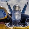 U.S. Navy Aviation Boatswain’s Mate (Handling) 2nd Class Michael Cordova directs an F/A-18E Super Hornet, attached to Strike Fighter Squadron (VFA) 14, on the flight deck of Nimitz-class aircraft carrier USS Abraham Lincoln (CVN 72) on Jan. 10, 2026. The Abraham Lincoln Carrier Strike Group is underway conducting routine operations in the U.S. 7th Fleet area of operations. Units assigned to 7th Fleet conduct regular Indo-Pacific patrols to deter aggression, strengthen alliances and partnerships, and advance peace through strength. (U.S. Navy photo by Mass Communication Specialist Seaman Daniel Kimmelman)