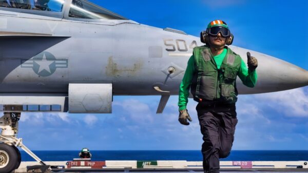 A U.S. Sailor signals the launch of an E/A-18G Growler aircraft, attached to Electronic Attack Squadron 142, from the flight deck of the world’s largest aircraft carrier, Ford-class aircraft carrier USS Gerald R. Ford (CVN 78), while underway in the Caribbean Sea, Jan. 31, 2026. U.S. military forces are deployed to the Caribbean in support of the U.S. Southern Command mission, Department of War-directed operations, and the president’s priorities to disrupt illicit drug trafficking and protect the homeland. (U.S. Navy photo)