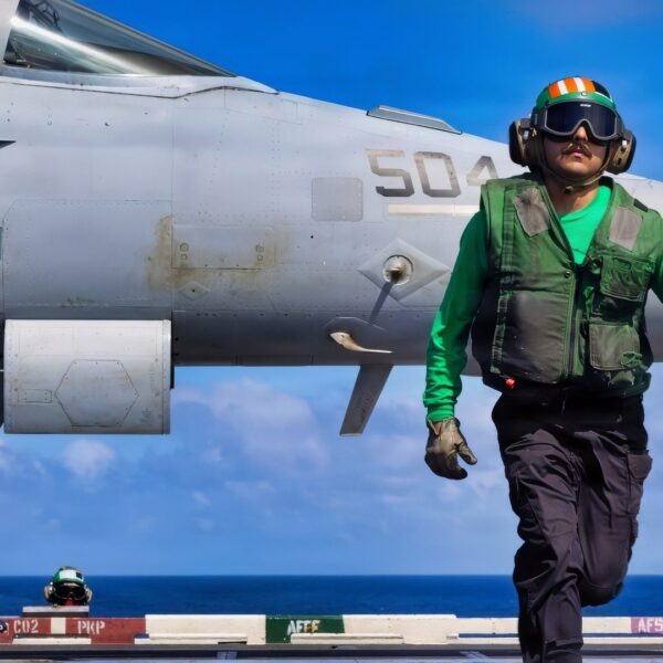 A U.S. Sailor signals the launch of an E/A-18G Growler aircraft, attached to Electronic Attack Squadron 142, from the flight deck of the world’s largest aircraft carrier, Ford-class aircraft carrier USS Gerald R. Ford (CVN 78), while underway in the Caribbean Sea, Jan. 31, 2026. U.S. military forces are deployed to the Caribbean in support of the U.S. Southern Command mission, Department of War-directed operations, and the president’s priorities to disrupt illicit drug trafficking and protect the homeland. (U.S. Navy photo)