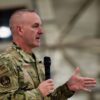 Chief Master Sgt. of the Air Force David Wolfe addresses a crowd of airmen assigned to the 48th Fighter Wing during a visit to RAF Lakenheath, England, Dec. 19, 2025. Wolfe emphasized that the U.S. Airmen enhance Europe's defensive posture by working side by side with allied forces in coordinated exercises, real-world missions, and emerging technology efforts. (U.S. Air Force photo by Airman 1st Class Rilynn Jacobs)