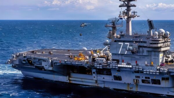 A MH-60S Seahawk helicopter assigned to the “Nightdippers” of Helicopter Sea Combat Squadron (HSC) 5 delivers cargo to the Nimitz-class aircraft carrier USS George H.W. Bush (CVN-77) during a vertical replenishment in the Atlantic Ocean, Feb. 15, 2026. The George H.W. Bush Carrier Strike Group is at sea training as an integrated warfighting team. Composite Training Unit Exercise (COMPTUEX) is the Joint Force’s most complex integrated training event and prepares naval task forces for sustained high-end Joint and combined combat. Integrated naval training provides combatant commanders and America’s civilian leaders highly capable forces that deter adversaries, underpin American security and economic prosperity, and reassure Allies and partners. (U.S. Navy photo by Mass Communication Specialist 2nd Class Mitchell Mason)