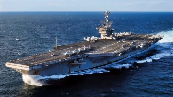 (Dec. 06, 2010) Sailors assigned to the Eagles of Strike Fighter Squadron (VFA) 115 move an F/A-18E Super Hornet on the flight deck aboard the aircraft carrier USS George Washington (CVN 73). George Washington is participating in Keen Sword 2010 with the Japanese Maritime Self-Defense Force through Dec. 10. (U.S. Navy photo by Mass Communication Specialist 3rd Class David A. Cox/Released)