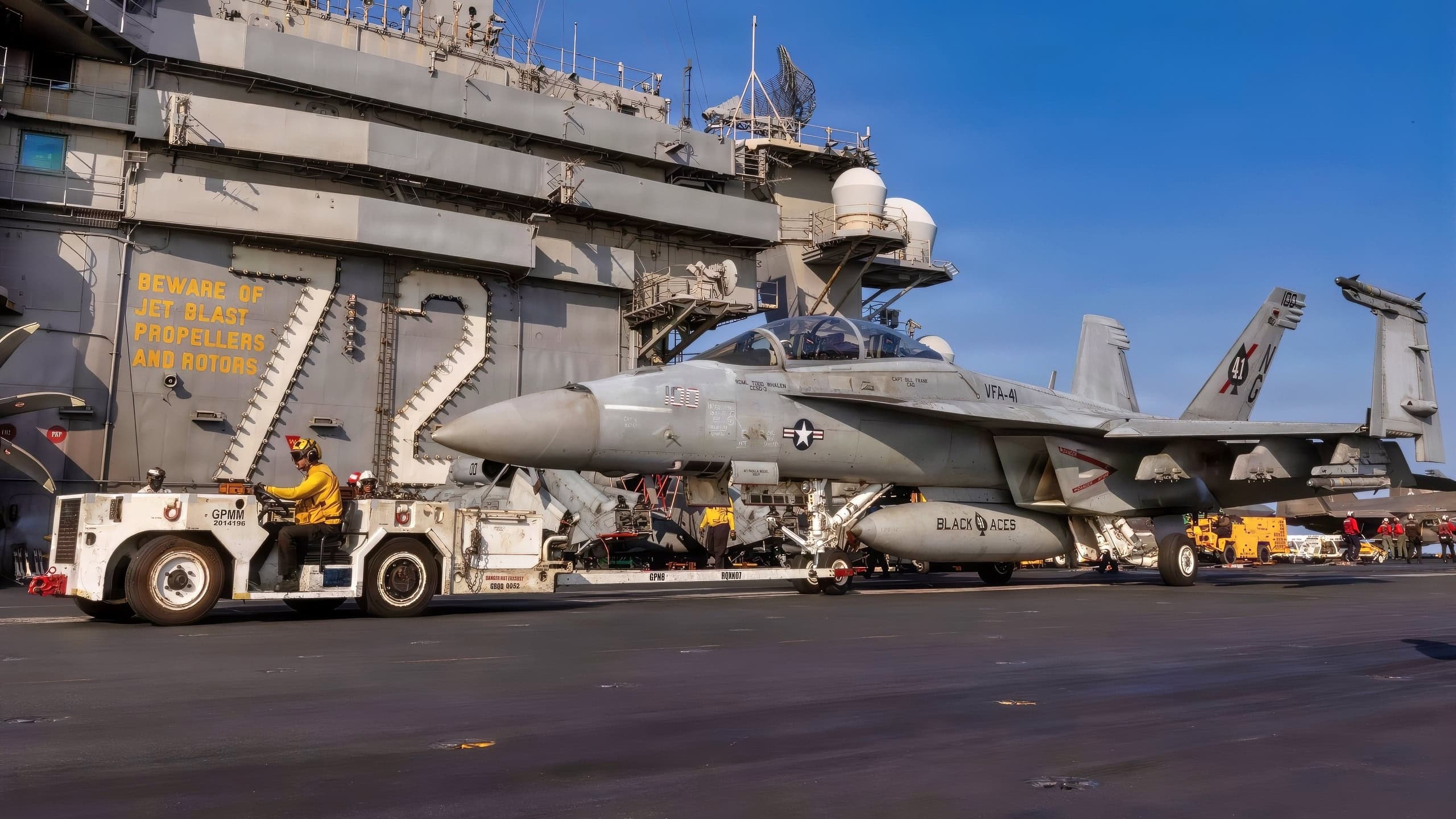 An F/A-18F Super Hornet, attached to Strike Fighter Squadron (VFA) 41, is taxied on the flight deck of Nimitz-class aircraft carrier USS Abraham Lincoln (CVN 72) in support of Operation Epic Fury, March 6, 2026. Abraham Lincoln is deployed to the U.S. 5th Fleet area of operations to support maritime security and stability in the Middle East. (U.S. Navy photo)