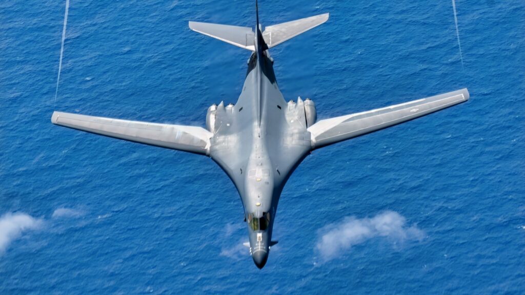 A U.S. Air Force B-1B Lancer assigned to the 34th Expeditionary Bomb Squadron, Ellsworth Air Force Base, S.D., descends after conducting aerial refueling with a KC-135 Stratotanker assigned to the 506th Expeditionary Air Refueling Squadron in support of Bomber Task Force 25-1 over the Pacific Ocean, Mar. 4, 2025. Bomber Task Force enhances readiness, to include joint and multilateral, to respond to any potential crisis or challenge in the Indo-Pacific. (U.S. Air Force photo by Airman 1st Class Alec Carlberg)