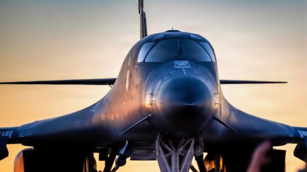 A U.S. Airman assigned to the 7th Bomb Wing marshals a U.S. Air Force B-1B