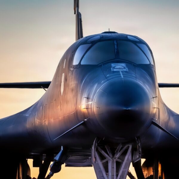 A U.S. Airman assigned to the 7th Bomb Wing marshals a U.S. Air Force B-1B