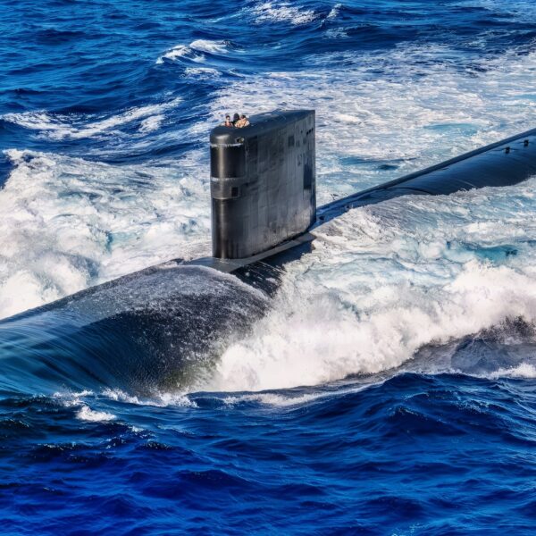 PACIFIC OCEAN (Dec. 17, 2025) - Los Angeles-class fast-attack submarine USS Annapolis (SSN 760) steams forward off the coast of Guam during a photo exercise, Dec. 17, 2025. Assigned to Commander, Submarine Squadron 15 at Polaris Point, Naval Base Guam, Annapolis is one of five fast-attack submarines forward-deployed in the Pacific. Renowned for their unparalleled speed, endurance, stealth, and mobility, fast-attack submarines serve as the backbone of the Navy's submarine force, ensuring readiness and agility in safeguarding maritime interests around the world. (U.S. Navy photo by Lt. James Caliva)