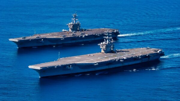 PACIFIC OCEAN (Feb. 13, 2022) Nimitz-class aircraft carriers USS Carl Vinson (CVN 70), back, and USS Nimitz (CVN 68) transit the Pacific Ocean, Feb. 13, 2022. Vinson and Nimitz are currently conducting routine maritime operations in U.S. 3rd Fleet. (U.S. Navy photo by Mass Communication Specialist Seaman Apprentice Joshua Sapien)
