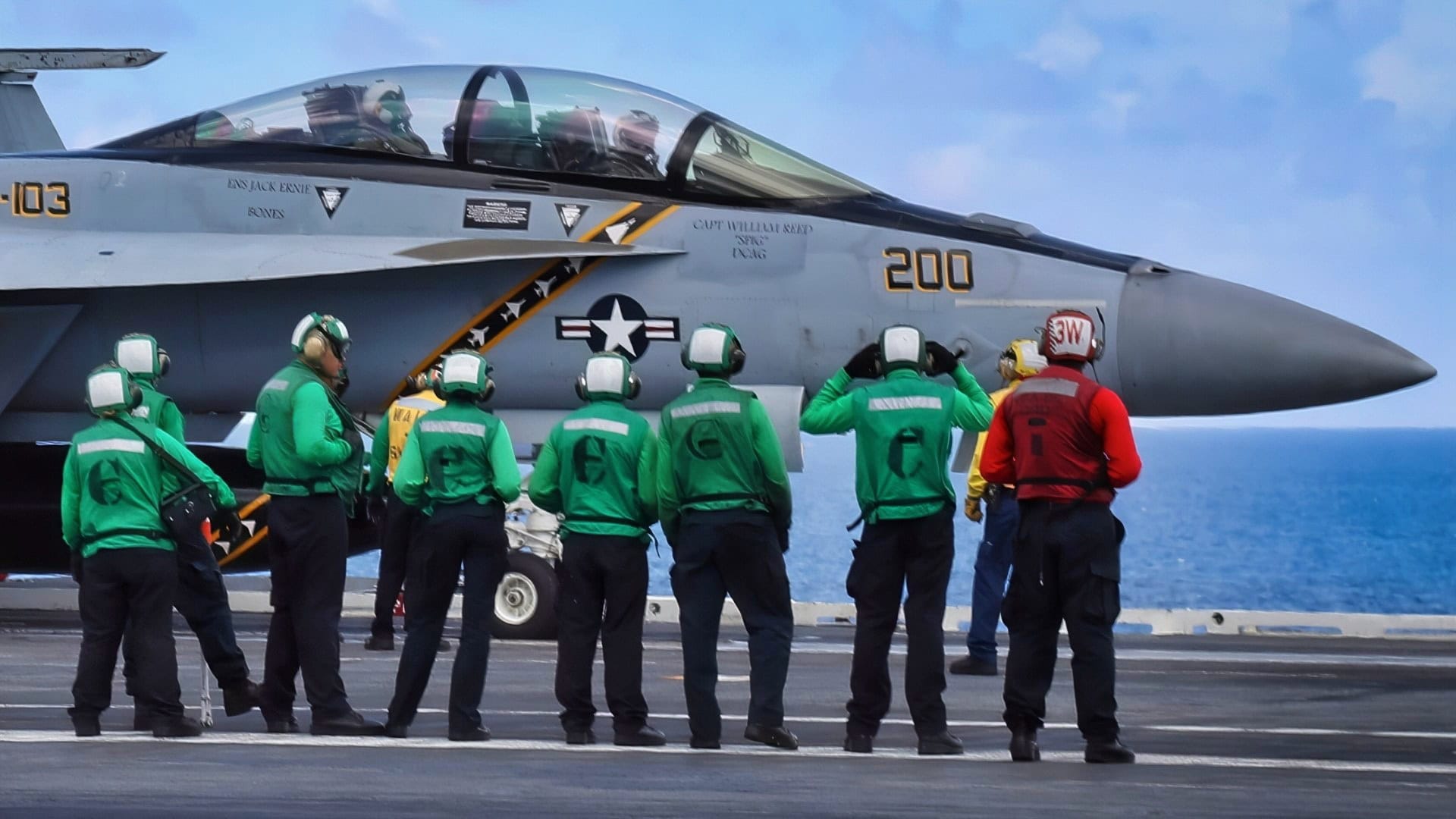 ATLANTIC OCEAN (Aug. 1, 2018) Sailors stand by as an F/A-18E Super Hornet from Strike Fighter Squadron (VFA) 103 taxies to a catapult on the flight deck aboard the Nimitz-class aircraft carrier USS Abraham Lincoln (CVN 72). (U.S. Navy photo by Mass Communication Specialist 3rd Class Jeff Sherman)