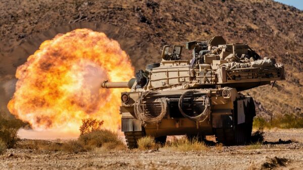 U.S. Soldiers assigned to 1st Battalion, 9th Cavalry Regiment, 2nd Armored Brigade Combat Team, 1st Cavalry Division fire an M1 Abrams main battle tank at an enemy target during Rotation 25-02 at the National Training Center, Fort Irwin, Calif., Nov. 07, 2024. Rotations at the National Training Center ensure Army Brigade Combat Teams remain versatile, responsive, and consistently available for current and future contingencies. (U.S. Army photo by Spc. Casey Auman, Operations Group, National Training Center).