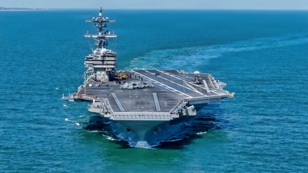 ATLANTIC OCEAN (March 31, 2026) Nimitz-class aircraft carrier USS George H.W. Bush (CVN 77) departs Naval Station Norfolk for a regularly scheduled deployment. The George H.W. Bush Carrier Strike Group departed Naval Station Norfolk on March 31, 2026. The strike group, comprised of nearly 5,000 Sailors, provides combatant commanders and America’s civilian leaders increased capacity to underpin American security and economic prosperity, deter adversaries, and project power on a global scale through sustained operations at sea. (U.S. Navy photo by Mass Communication Specialist 2nd Class Jayden Brown)