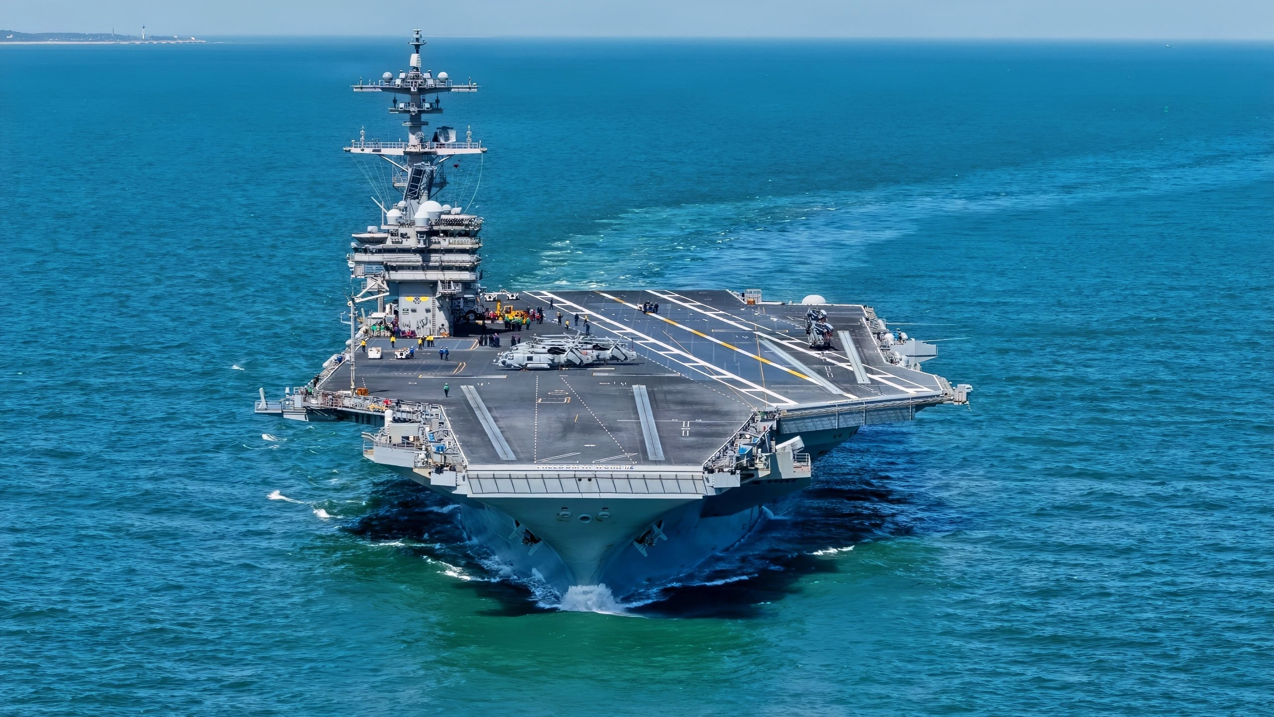 ATLANTIC OCEAN (March 31, 2026) Nimitz-class aircraft carrier USS George H.W. Bush (CVN 77) departs Naval Station Norfolk for a regularly scheduled deployment. The George H.W. Bush Carrier Strike Group departed Naval Station Norfolk on March 31, 2026. The strike group, comprised of nearly 5,000 Sailors, provides combatant commanders and America’s civilian leaders increased capacity to underpin American security and economic prosperity, deter adversaries, and project power on a global scale through sustained operations at sea. (U.S. Navy photo by Mass Communication Specialist 2nd Class Jayden Brown)