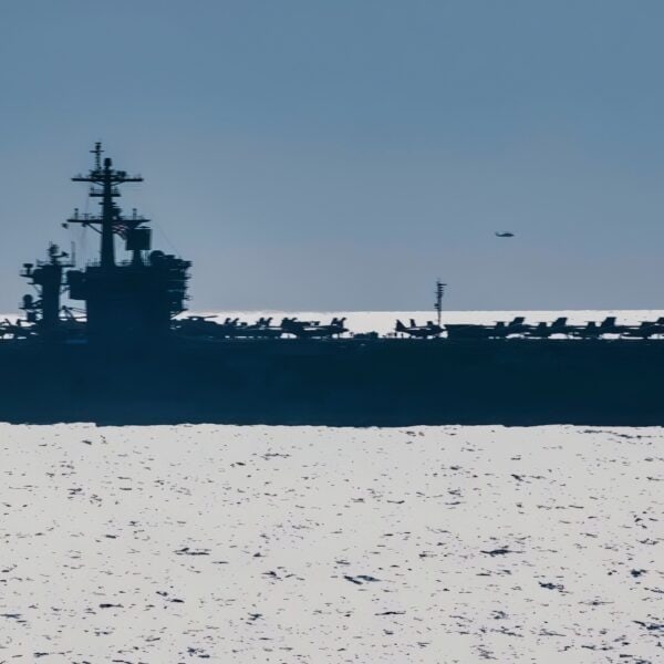 ATLANTIC OCEAN (Aug. 30, 2018) An MH-60S Sea Hawk helicopter assigned to Carrier Air Wing (CVW) 7 flies by the Nimitz-class aircraft carrier USS Abraham Lincoln (CVN 72) during dual-carrier sustainment operations with the Nimitz-class aircraft carrier USS Harry S. Truman (CVN 75). In addition to demonstrating the Navy's inherent flexibility and scalability, this evolution provides the opportunity to conduct complex, multi-unit training to enhance maritime interoperability and combat readiness; prepare the Navy to protect our homeland; and preserve and promote peace anywhere around the world. (U.S. Navy photo by Mass Communication Specialist 3rd Class Juan Sotolongo/Released)