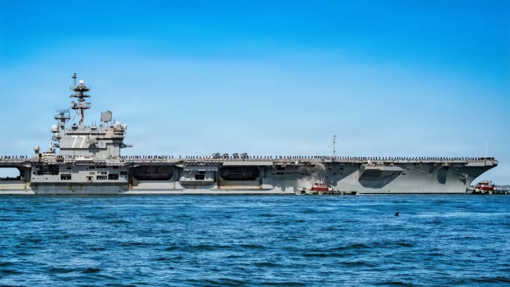 NAVAL STATION NORFOLK (March 31, 2026) The Nimitz-class aircraft carrier USS George H.W. Bush (CVN 77), the flagship of the George H.W. Bush Carrier Strike Group, departs Naval Station Norfolk to begin operations in support of its scheduled deployment, March 31, 2026. More than 5,000 personnel are assigned to the George H.W. Bush Carrier Strike Group. The George H.W. Bush Carrier Strike Group provides combatant commanders and America’s civilian leaders increased capacity to underpin American security and economic prosperity, deter adversaries, and project power on a global scale through sustained operations at sea. (U.S. Navy photo by Mass Communication Specialist 2nd Class Derek Cole)
