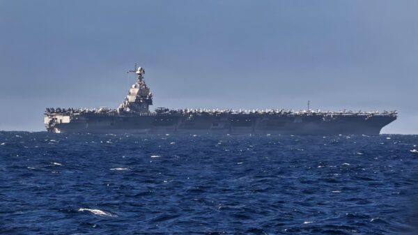 The world’s largest aircraft carrier, USS Gerald R. Ford, as seen from Arleigh Burke-class guided missile destroyer USS Bainbridge (DDG 96) before a replenishment-at-sea with Henry J. Kaiser-class fleet replenishment oiler USNS Kanawha (T-AO 196) while underway during Operation Epic Fury, Mar. 8, 2026. (U.S. Navy Photo)