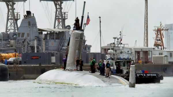BAHRAIN (March 21, 2009) The Los Angeles-class attack submarine USS Hartford (SSN 768) arrives pier side at Mina Salman pier in Bahrain where U.S. Navy engineers and inspection teams will asses and evaluate damage that resulted from a collision with the amphibious transport dock ship USS New Orleans (LPD 18) in the Strait of Hormuz March 20. Overall damage to both ships is being evaluated. The incident remains under investigation. Hartford is deployed to the U.S. 5th fleet area of responsibility to support maritime security operations. (U.S. Navy photo by Cmdr. Jane Campbell/Released) (c)RoebuckPhoto
