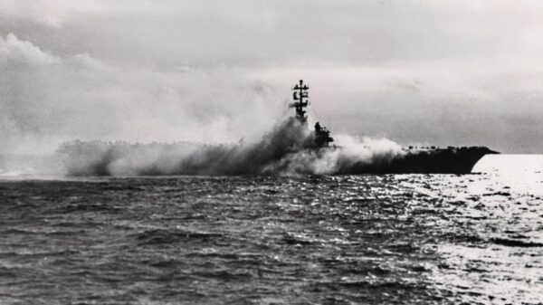 The U.S. Navy aircraft carrier USS Oriskany (CVA-34) on fire, 26 October 1966. Smoke pours from Oriskany's Hangar Bay No.1, during the fire which killed 44 of her officers and men.