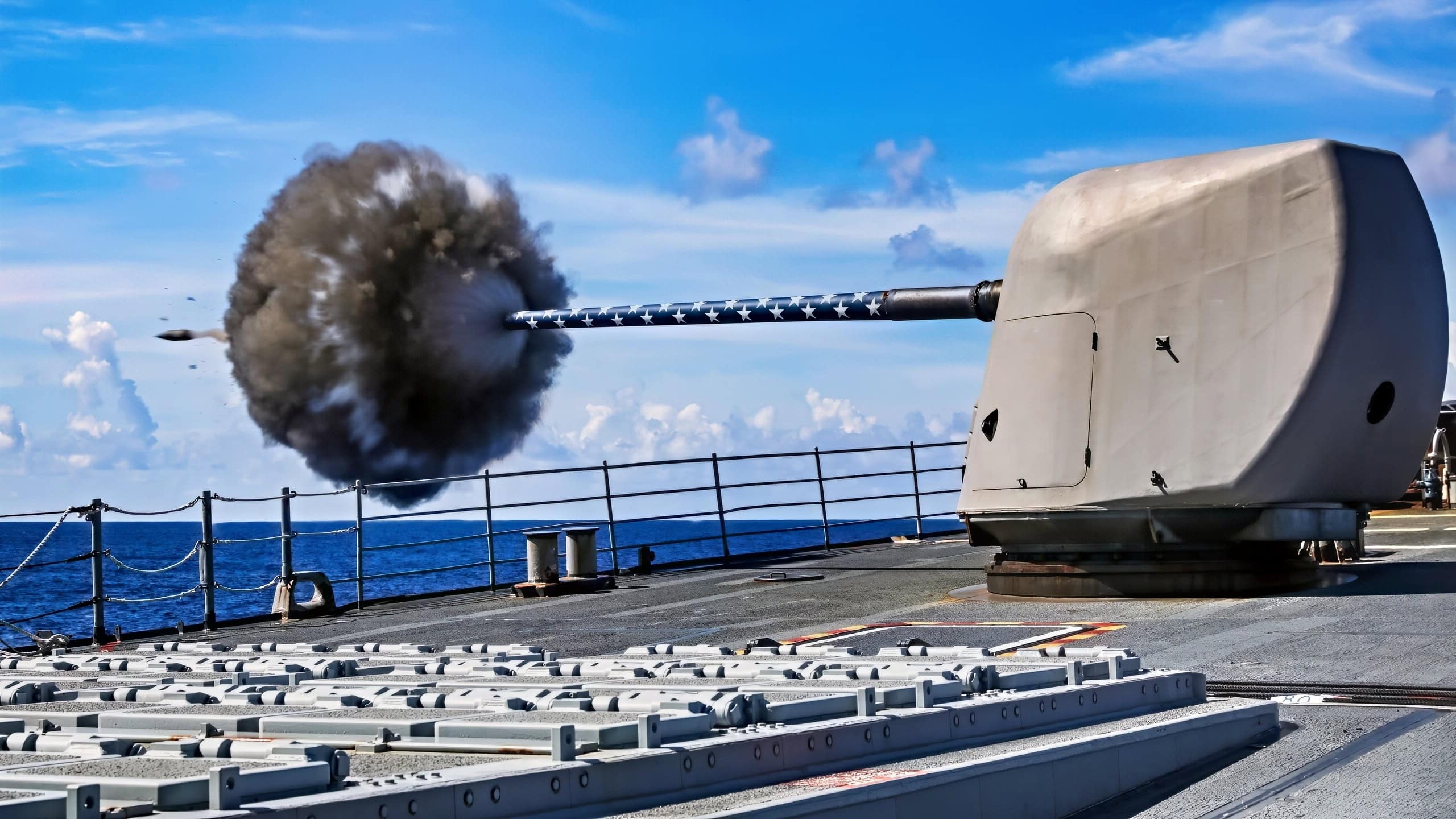 (July 29, 2025) The Ticonderoga-class guided-missile cruiser USS Princeton (CG 59) fires its forward Mark 45 5-inch gun during a weapons maintenance shoot, July 29, 2025. The Carl Vinson Carrier Strike Group is underway conducting routine operations in the U.S. 3rd Fleet area of operations. (U.S. Navy photo by Mass Communication Specialist 1st Class Jacob I. Allison)