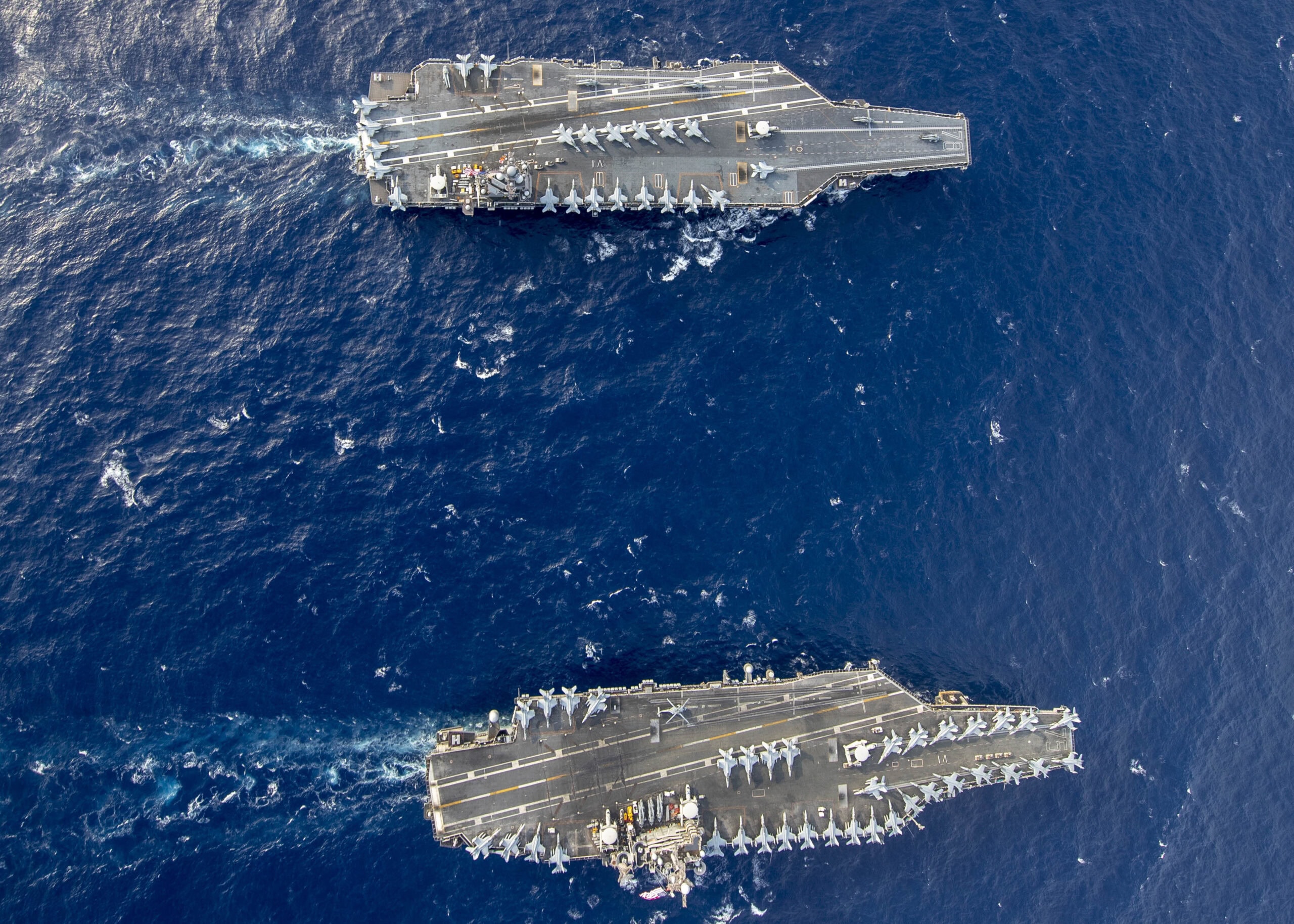 The Ford-class aircraft carrier USS Gerald R. Ford (CVN 78) and the Nimitz-class aircraft carrier USS Harry S. Truman (CVN 75) transit the Atlantic Ocean June 4, 2020, marking the first time a Ford-class and a Nimitz-class aircraft carrier operated together underway. Ford is underway conducting integrated air wing operations, and the Harry S. Truman Carrier Strike Group remains at sea in the Atlantic as a certified carrier strike group force ready for tasking in order to protect the crew from the risks posed by COVID-19, following their successful deployment to the U.S. 5th and 6th Fleet areas of operation. (U.S. Navy photo by Mass Communication Specialist Seaman Riley McDowell)
