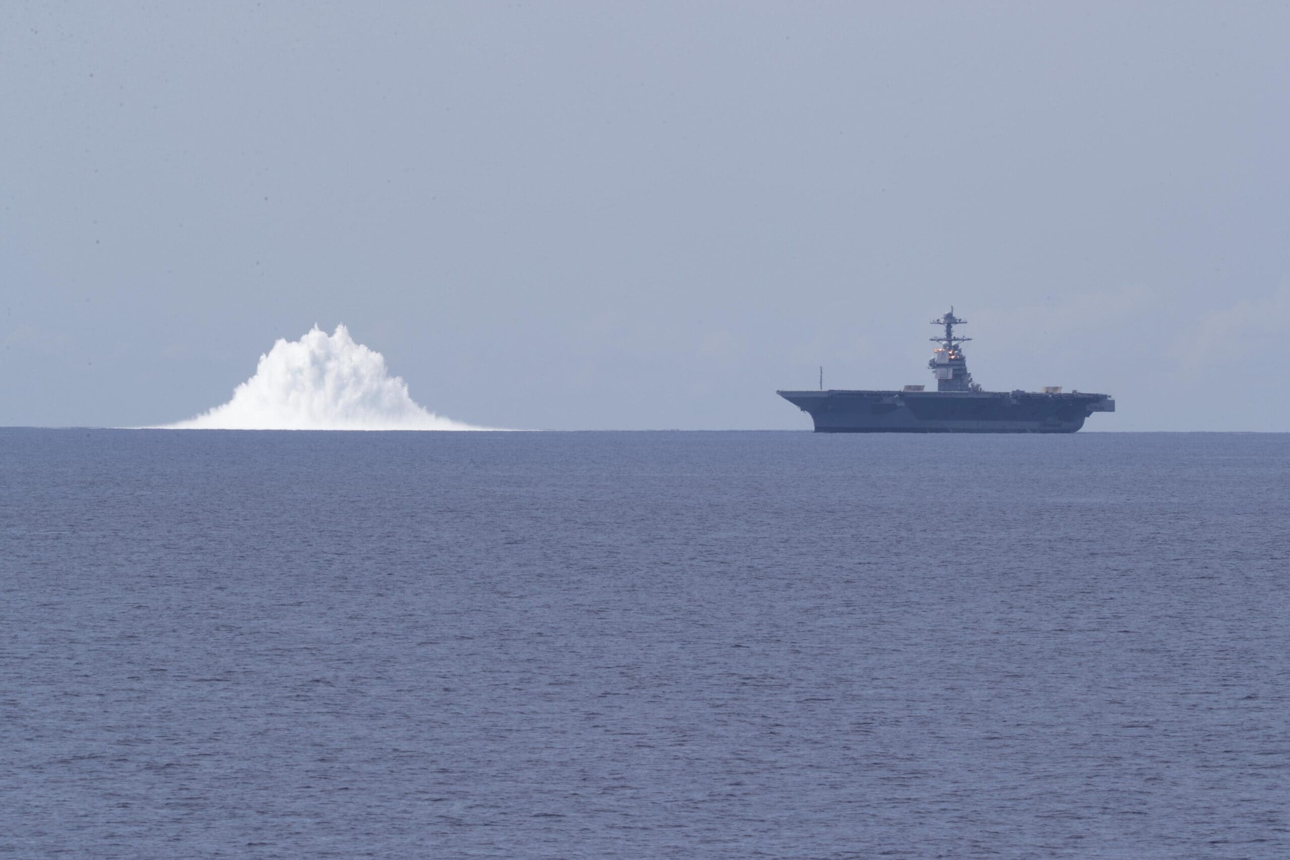 The aircraft carrier USS Gerald R. Ford (CVN 78) completes the first scheduled explosive event of Full Ship Shock Trials while underway in the Atlantic Ocean, June 18, 2021. The U.S. Navy conducts shock trials of new ship designs using live explosives to confirm that our warships can continue to meet demanding mission requirements under harsh conditions they might encounter in battle. (U.S. Navy photo by Mass Communication Specialist 3rd Class Zachary Melvin)