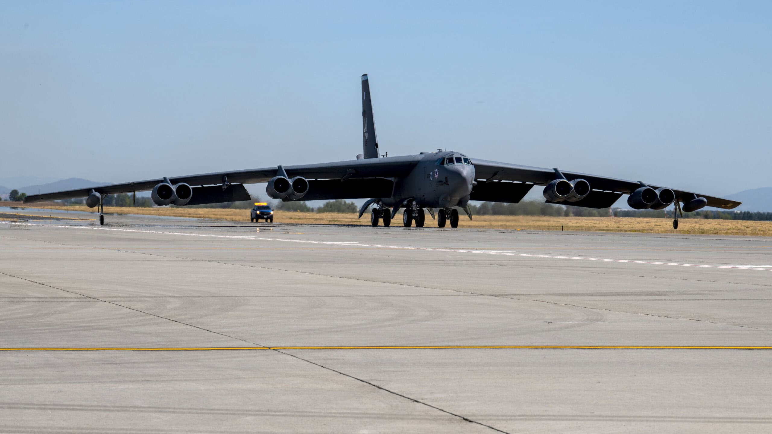 A B-52 Stratofortress from Barksdale AFB lands on the flight line at Fairchild Air Force Base, Washington, Aug. 16, 2022. The B-52s landed at Fairchild to conduct their own Agile Combat Employment exercise creating more multi-capable Airmen ready to deploy anywhere, anytime. (U.S. Air Force photo by Staff Sgt. Lawrence Sena)