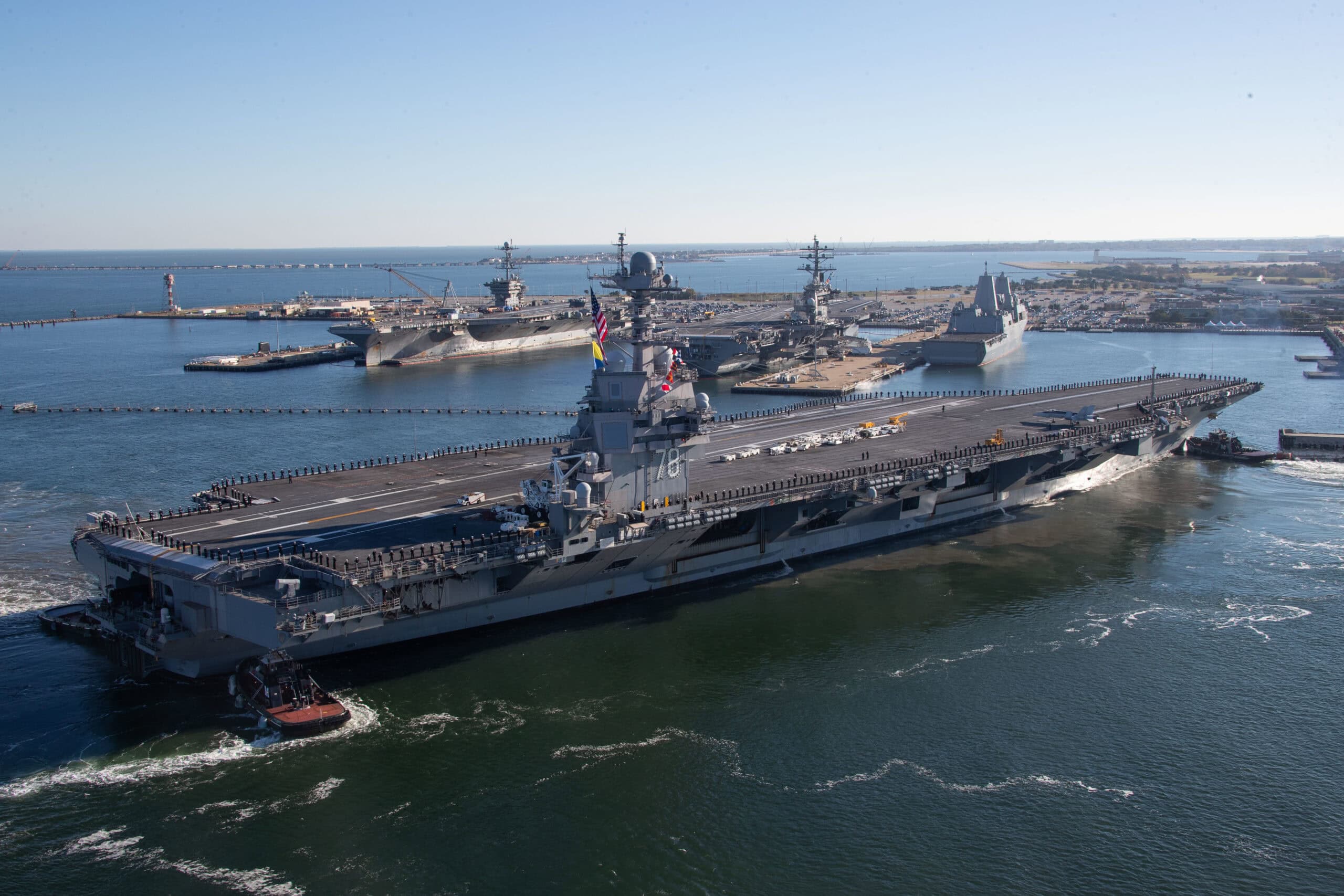 The crew of the first-in-class aircraft carrier USS Gerald R. Ford (CVN 78) man the rails as the ship returns to Naval Station Norfolk, Nov. 26, following the inaugural deployment with the Gerald R. Ford Carrier Strike Group (GRFCSG). More than 4,600 Sailors assigned to Ford operated in U.S. 2nd Fleet and 6th Fleet, increasing interoperability and interchangeability with NATO Allies and partners. Throughout the deployment, the GRFCSG sailed more than 9,200 miles, completed more than 1,250 sorties, expended 78.3 tons of ordnance, completed 13 underway replenishments and hosted more than 400 distinguished visitors. (U.S. Navy photo by Mass Communication Specialist 2nd Class Jackson Adkins)