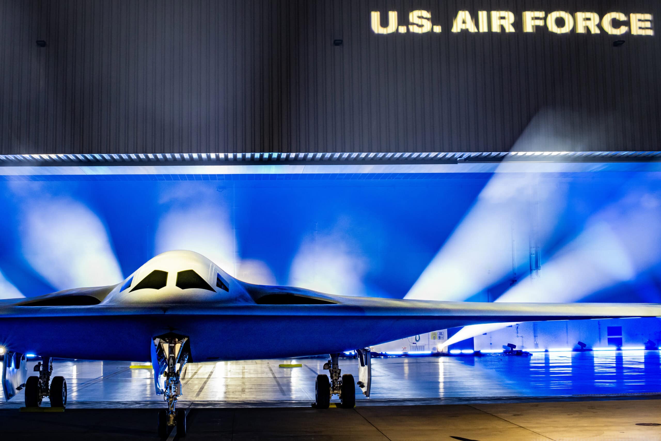 A B-21 Raider is unveiled at Northrop Grumman’s manufacturing facility on Air Force Plant 42 in Palmdale, California, Dec. 2, 2022. The B-21 will be a long-range, highly survivable, penetrating strike stealth bomber capable of delivering both conventional and nuclear munitions. (U.S. Air Force photo by Airman 1st Class Joshua M. Carroll)