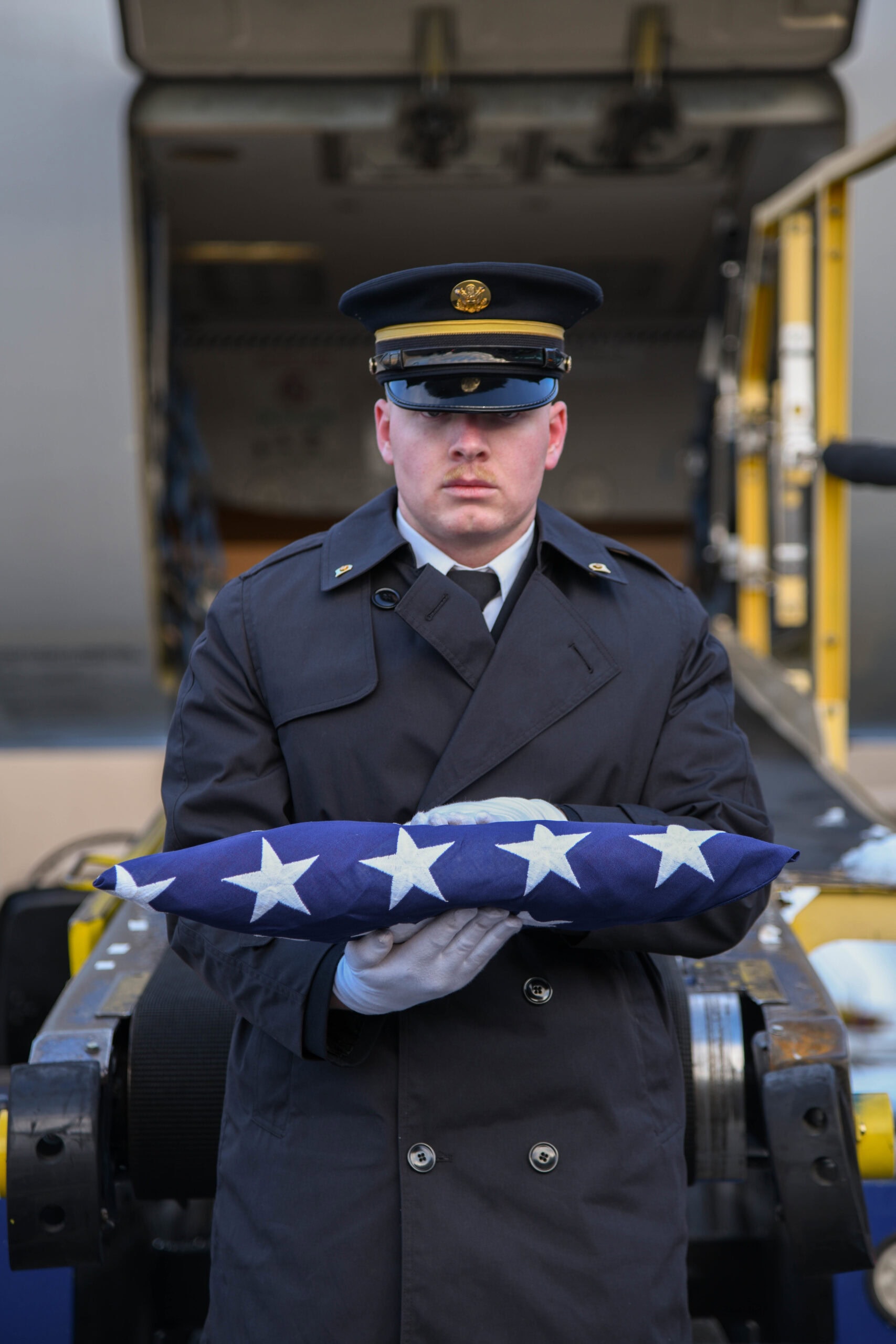 The Utah National Guard Honor Guard conducts an Honorable Carry on Dec. 15, 2022, for the surviving family of U.S. Army Air Forces Cpl. Merle L. Pickup, a Soldier who died in India, 78 years ago, following a plane crash during World War II. Reported MIA in 1944, Pickup’s remains were recently identified and now repatriated to his home in Utah nearly 80 years later. Family coming from several states, even as far as Europe, gathered to render respect during the carry at Salt Lake City International Airport. (U.S. Army National Guard photo by Staff Sgt. Jordan Hack)