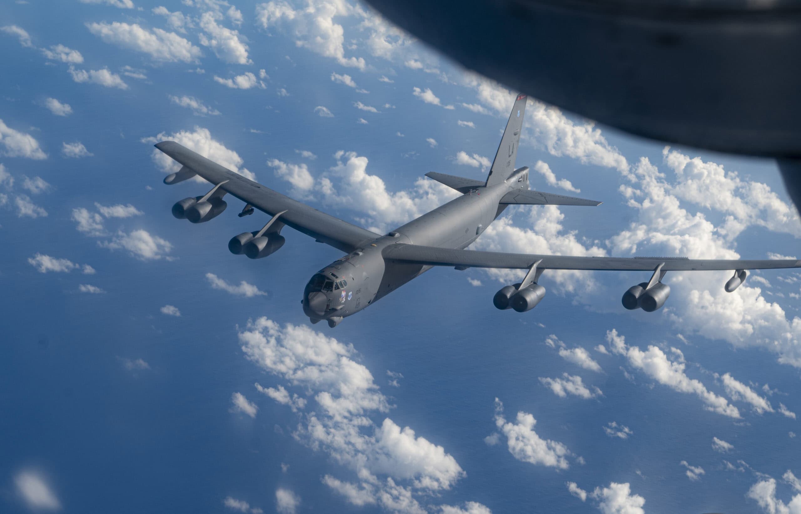 A B-52 Stratofortress assigned to the 2nd Bomber Wing at Barksdale Air Force Base, Louisiana, flies next to a KC-135 during a bomber task force mission over the Pacific Ocean, Dec. 17, 2022. Bomber missions demonstrate our long-range precision strike capabilities, which are integral to enforcing a free and open Indo-Pacific. (U.S. Air Force photo by 2nd Lt. Ariana Wilkinson)