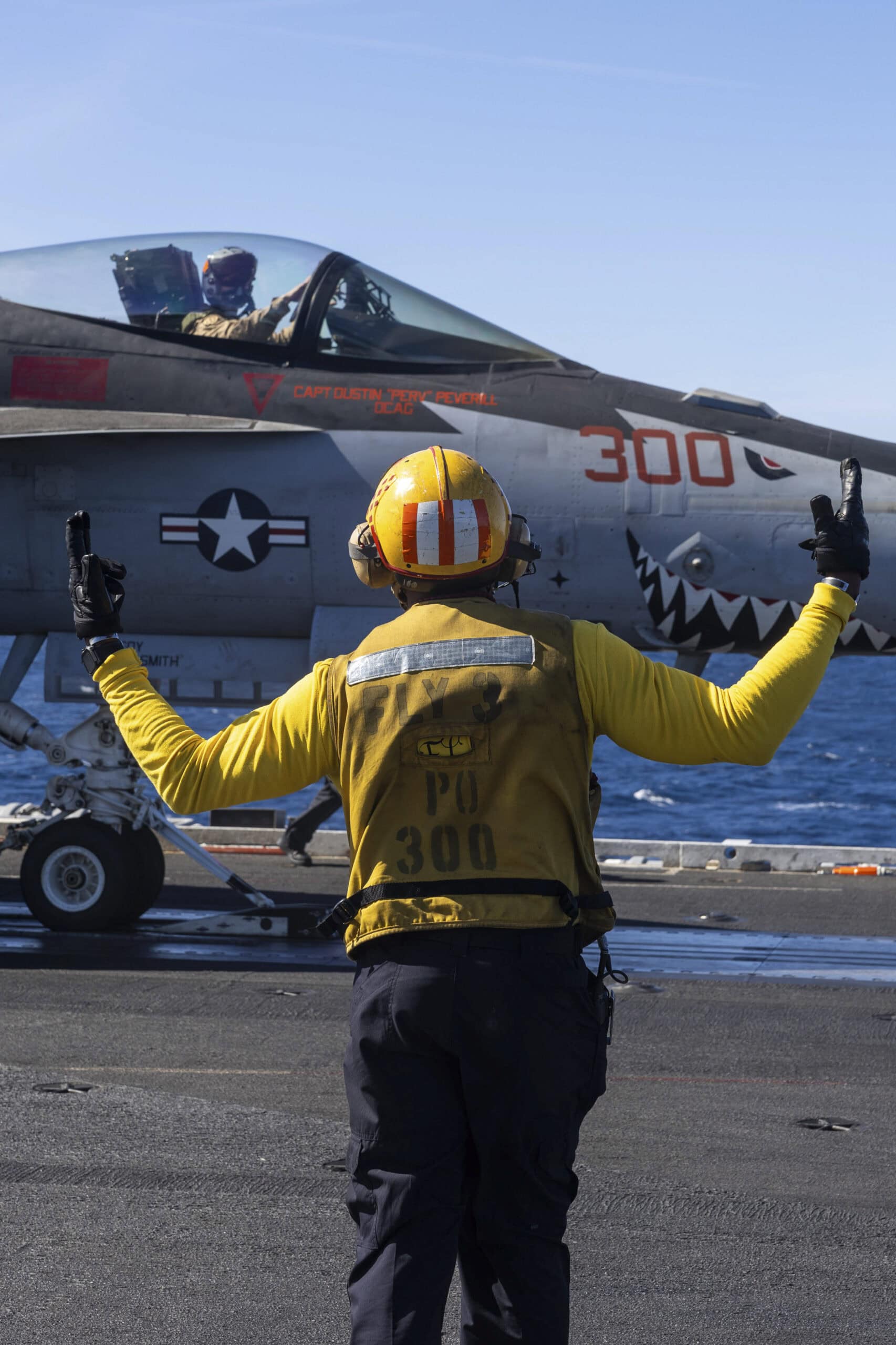 U.S. CENTRAL COMMAND AREA OF RESPONSIBILITY (Dec. 29, 2024) A U.S. Navy Aviation Boatswain's Mate (Aircraft Handling) prepares an F/A-18E Super Hornet, attached to Strike Fighter Squadron (VFA) 81, for launch from the flight deck of the Nimitz-class aircraft carrier USS Harry S. Truman (CVN 75) in the U.S. Central Command area of responsibility. (Official U.S. Navy photo)