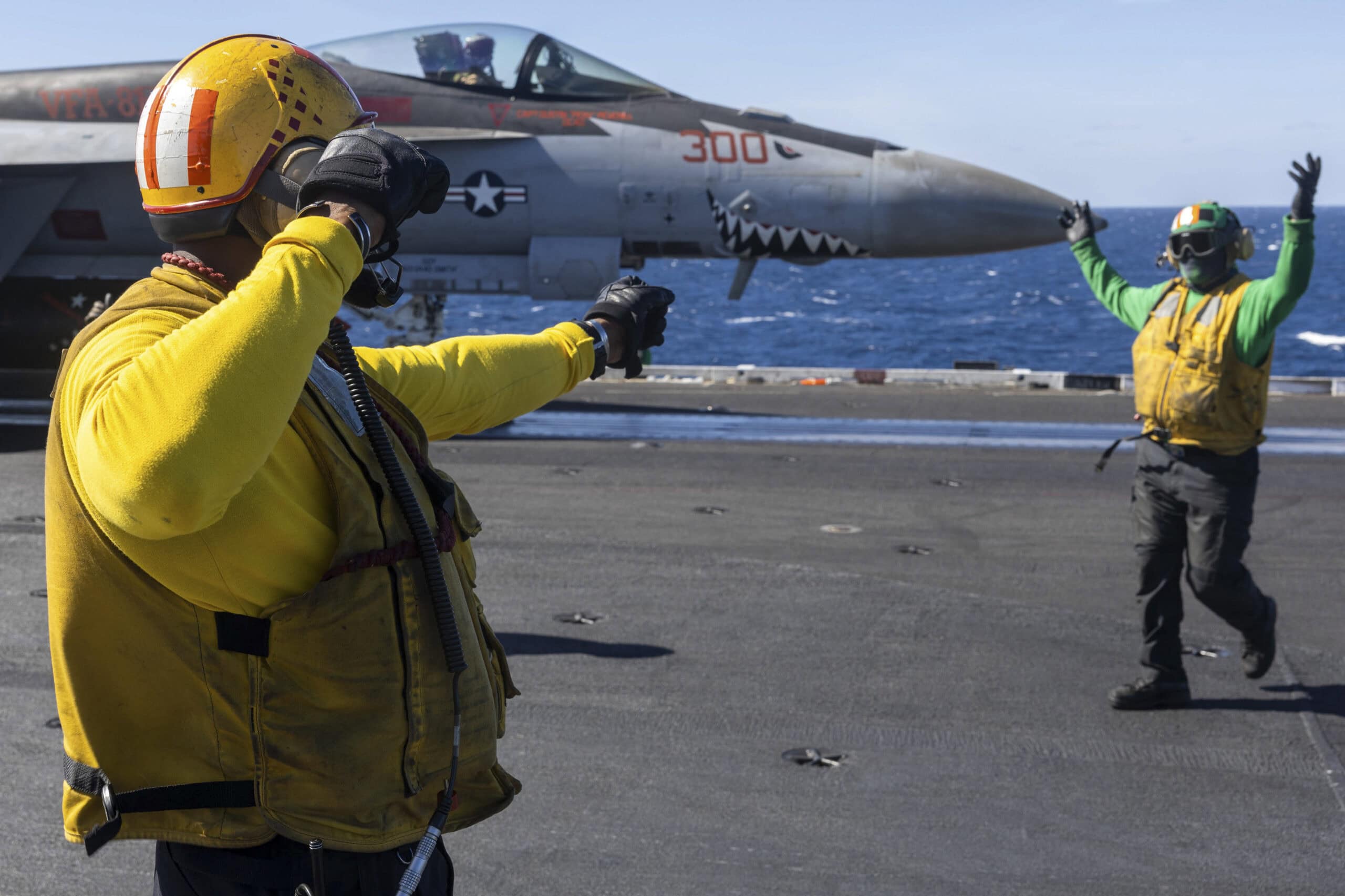 U.S. CENTRAL COMMAND AREA OF RESPONSIBILITY (Dec. 29, 2024) A U.S. Navy Aviation Boatswain's Mate (Aircraft Handling), left, and a U.S. Navy Aviation Boatswain's Mate (Equipment) prepare an F/A-18E Super Hornet, attached to Strike Fighter Squadron (VFA) 81, for launch from the flight deck of the Nimitz-class aircraft carrier USS Harry S. Truman (CVN 75) in the U.S. Central Command area of responsibility. (Official U.S. Navy photo)