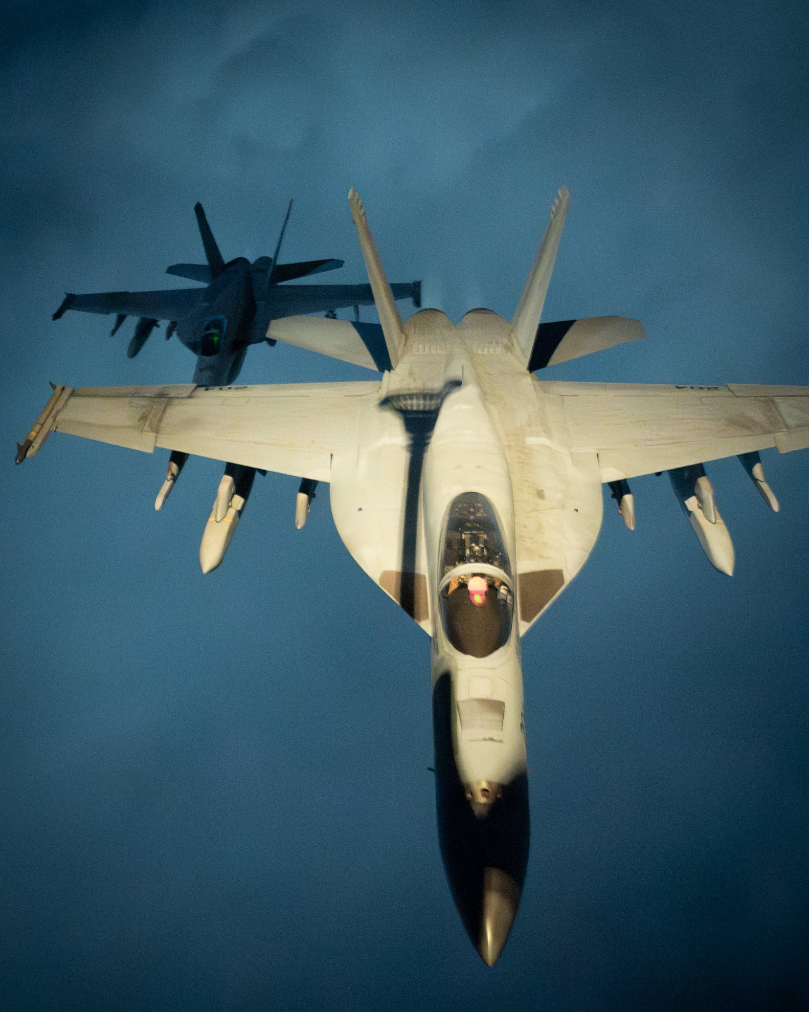 Two U.S. Navy F/A-18 Super Hornets fly in formation over the U.S. Central Command area of responsibility, April 5, 2025. The Super Hornets are assigned to the Truman Carrier Strike Group, which is responsible for patrolling approximately 2.5 million square miles of water space and includes the Arabian Gulf, Gulf of Oman, Red Sea, parts of the Indian Ocean and three critical choke points at the Strait of Hormuz, Suez Canal and Strait of Bab al-Mandeb (U.S. Air Force photo by Staff Sgt. Gerald R. Willis)