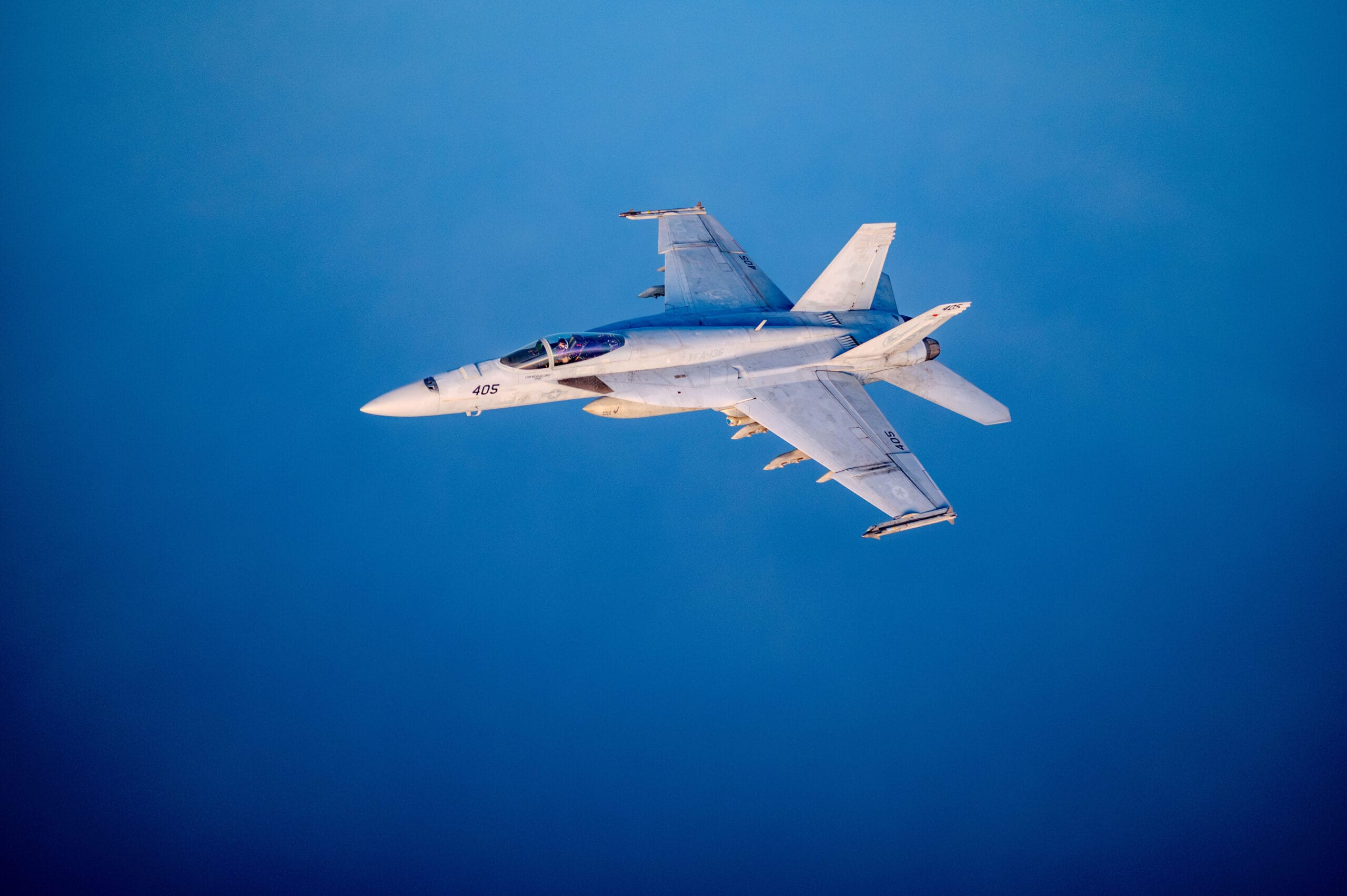 A U.S. Navy F/A-18 Super Hornet, assigned to the Harry S. Truman Carrier Strike Group, flies a mission over the U.S. Central Command area of responsibility, April 8, 2025. The HSTCSG is responsible for patrolling approximately 2.5 million square miles of ocean and includes the Arabian Gulf, Gulf of Oman, Red Sea, parts of the Indian Ocean and three critical choke points at the Strait of Hormuz, Suez Canal and Strait of Bab al-Mandeb. (U.S. Air Force photo by Staff Sgt. Jackson Manske)