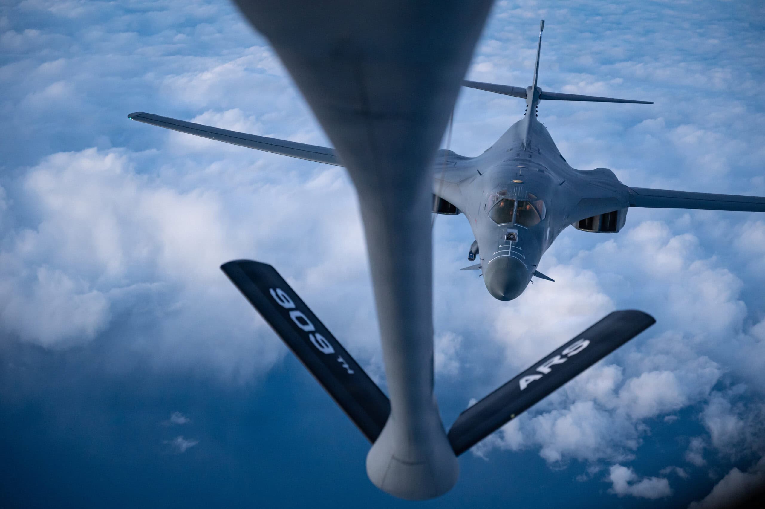 A U.S. Air Force B-1B Lancer assigned to the 9th Expeditionary Bomb Squadron, refuels from a KC-135 Stratotanker assigned to the 909th Air Refueling Squadron, Kadena Air Base, Japan, during a Bomber Task Force mission over the Pacific Ocean, Oct. 20, 2025. The KC-135 can transfer up to 200,000 pounds of fuel, increasing the B-1’s range to deliver a wide variety of munitions throughout the Indo-Pacific region. (U.S. Air Force photo by Master Sgt. Micaiah Anthony)