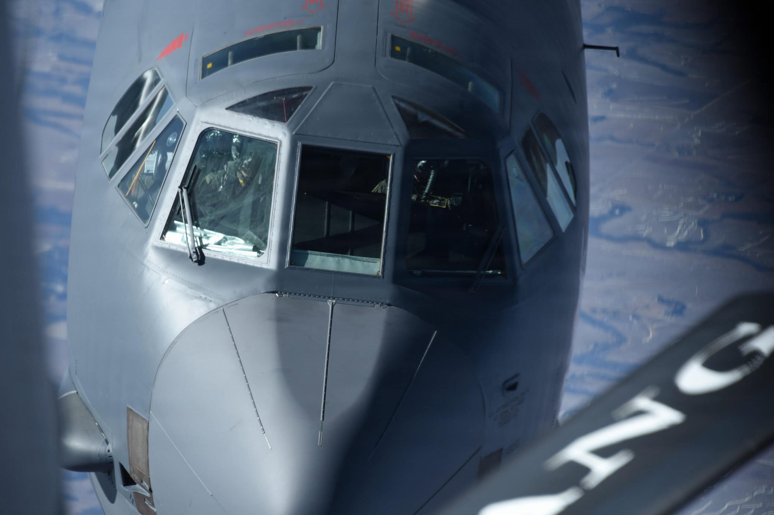 A U.S. Air Force B-52H Stratofortress assigned to the 5th Bomb Wing of Minot Air Force Base flies behind a U.S. Air Force KC-135 Stratotanker assigned to the 185th Air Refueling Wing of the Iowa Air National Guard over Kansas, Feb 5, 2026. Aerial refueling operations are routinely conducted to support training and mission requirements. (U.S. Air National Guard photo by 1st Lt. Daniel Ter Haar)