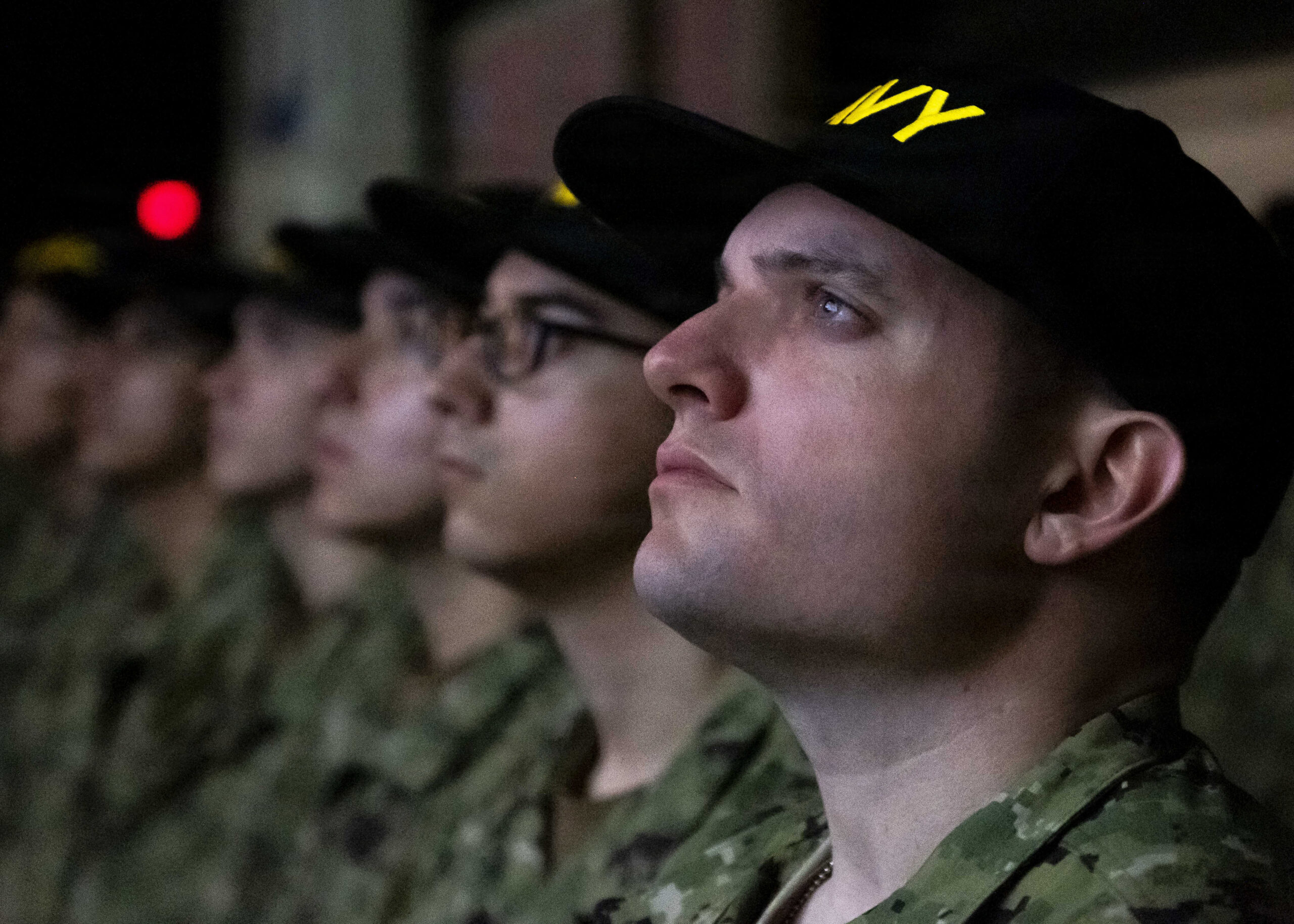 1116 GREAT LAKES, Ill. (Mar. 26, 2026) – Sailors stand at attention during the capping ceremony at USS Trayer (BST-21) onboard Recruit Training Command (RTC), Mar. 26, 2026. Trayer, more commonly referred to as “Battle Stations,” is the crucible event that recruits are required to pass prior to graduation, testing their knowledge and skills in basic seamanship, damage control, firefighting and emergency response procedures. Training is approximately nine weeks and all enlistees in the U.S. Navy begin their career at the command. More than 40,000 recruits train annually at the Navy’s only boot camp. (U.S. Navy photo by Mass Communication Specialist 2nd Class Jacob West)