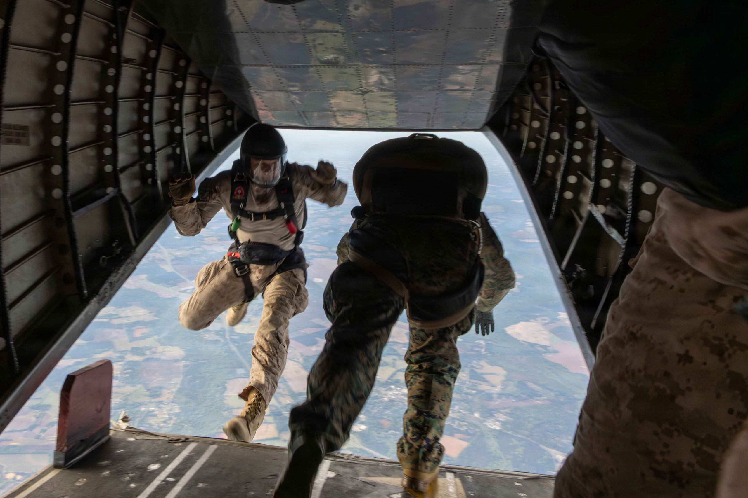 U.S. Marines with Maritime Raid Force, 24th Marine Expeditionary Unit, jump off the ramp of an aircraft while conducting a free-fall jump at Maxton, North Carolina, April 7, 2026. The training was conducted to rehearse aerial insertion tactics over difficult terrain to support expeditionary operations. (U.S. Marine Corps photo by Daniel R. Garcia)