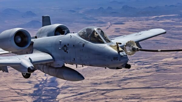 An A-10 Thunderbolt II maintains formation with a C-130 tanker during probe and drogue refueling operations, April 2, 2026. The Probe Refueling Adapter allows A-10s to refuel from C-130 tankers, significantly expanding refueling options for deployed units.