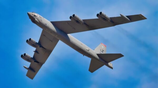 A U.S. Air Force B-52 Stratofortress aircraft, assigned to the 96th Bomb Squadron from Barksdale Air Force Base, Louisiana, flies over spectators at the Dubai Airshow 2025, Nov. 17, 2025, at the Al Maktoum International Airport in Dubai, United Arab Emirates. The B-52 flew from Rota, Spain, to participate in the event, showcasing U.S. airpower on a global stage. (U.S. Air Force photo by Staff Sgt. Tylin Rust)