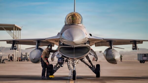U.S. Air Force Senior Airman Gregory Chastang, a crew chief assigned to the 857th Aircraft Maintenance Squadron, conducts a post-flight inspection on an F-16C Fighting Falcon assigned to the 16th Weapons Squadron, U.S. Air Force Weapons School, at Nellis Air Force Base, Nevada, Feb. 24, 2026. Members of the 857th AMXS performed pre- and post-flight inspections, and launch and recovery for F-16Cs following a mission. (U.S. Air Force photo by Airman 1st Class Jennifer Nesbitt)