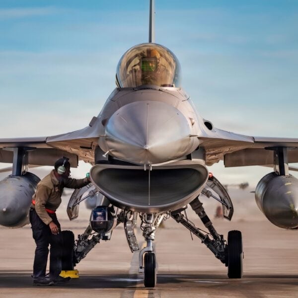 U.S. Air Force Senior Airman Gregory Chastang, a crew chief assigned to the 857th Aircraft Maintenance Squadron, conducts a post-flight inspection on an F-16C Fighting Falcon assigned to the 16th Weapons Squadron, U.S. Air Force Weapons School, at Nellis Air Force Base, Nevada, Feb. 24, 2026. Members of the 857th AMXS performed pre- and post-flight inspections, and launch and recovery for F-16Cs following a mission. (U.S. Air Force photo by Airman 1st Class Jennifer Nesbitt)