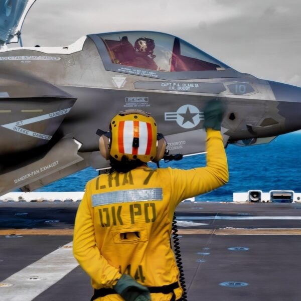 Aviation Boatswain’s Mate (Aircraft Handling) 3rd Class Anika Ramos directs the launch of an F-35B Lighting II, attached to Marine Fighter Attack Squadron 242 during flight operations on the flight deck of the America-class amphibious assault ship USS Tripoli (LHA 7) in the South China Sea, Dec. 11, 2025.