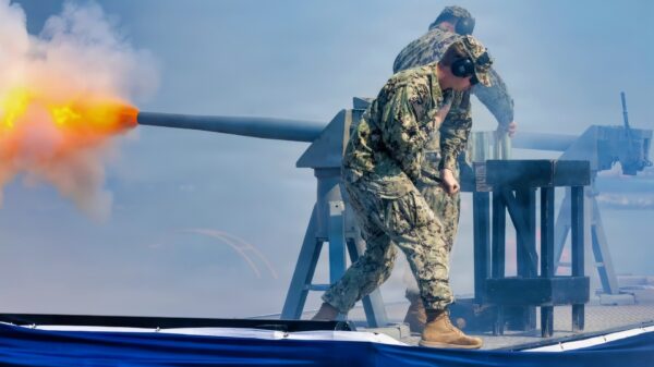 NORFOLK, Va. (April 11, 2026) – Gunner’s Mate 2nd Class Charles Sullivan and Gunner’s Mate 2nd Class Adams Correa, assigned to Naval Station Norfolk Security Department’s Weapons Division, fire a 40 mm cannon during the commissioning ceremony of the Navy’s newest Arleigh Burke-class guided-missile destroyer USS Harvey C. Barnum Jr. (DDG 124) in Norfolk, Virginia, April 11, 2026. The warship bears the name of a living Medal of Honor recipient, retired Col. Harvey C. “Barney” Barnum Jr. (U.S. Navy photo by Mass Communication Specialist 1st Class Theoplis Stewart)