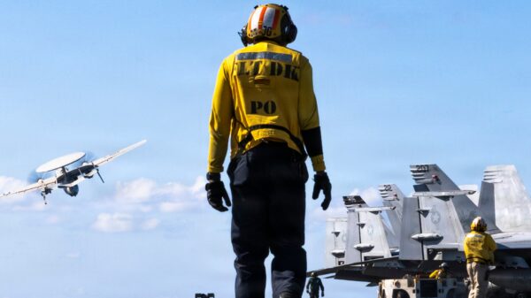Aviation Boatswain’s Mate (Aircraft Handling) 2nd Class Jawan George transits the flight deck of the world's largest aircraft carrier, USS Gerald R. Ford (CVN 78), while underway in the Mediterranean Sea, April 6, 2026. Gerald R. Ford is on a scheduled deployment in the U.S. 6th Fleet area of operations to support the warfighting effectiveness, lethality and readiness of U.S. Naval Forces Europe-Africa, and defend U.S., Allied and partner interests in the region. (U.S. Navy photo by Mass Communication Specialist Seaman Paige Brown)