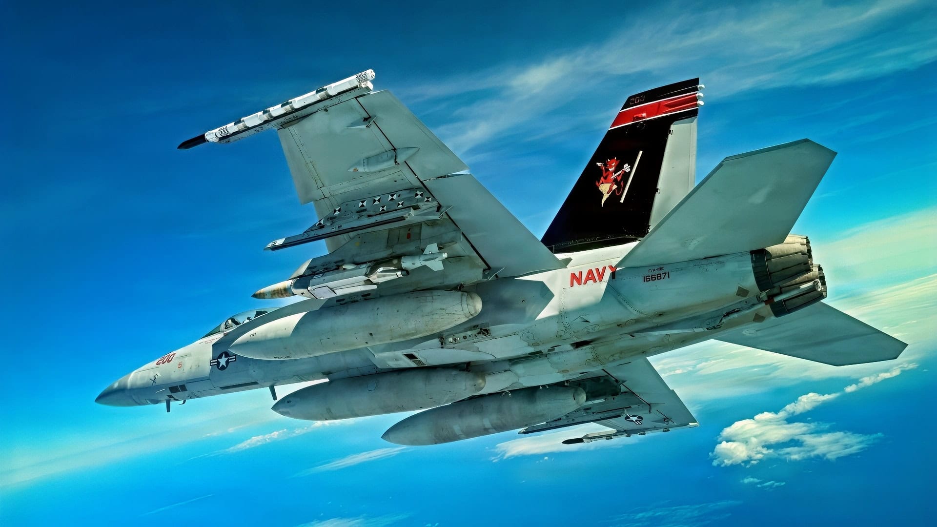 A Navy F/A-18 carries the new Joint Direct Attack Munition (JDAM) Long Range (LR) variant during a test event in early April off the coast of California (U.S. Navy photo/released)