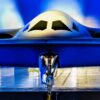A B-21 Raider is unveiled at Northrop Grumman’s manufacturing facility on Air Force Plant 42 in Palmdale, California, Dec. 2, 2022. The B-21 will be a long-range, highly survivable, penetrating strike stealth bomber capable of delivering both conventional and nuclear munitions. (U.S. Air Force photo by Airman 1st Class Joshua M. Carroll)